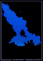 A crack in the Wall... My wife entering a cave in the Red... by Michel Lonfat 